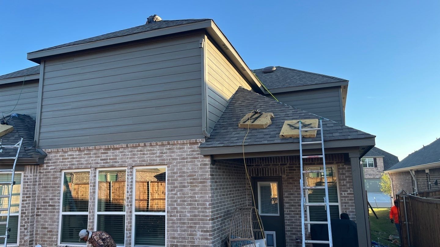 New seamless aluminum gutters installed after roof replacement in Anna
