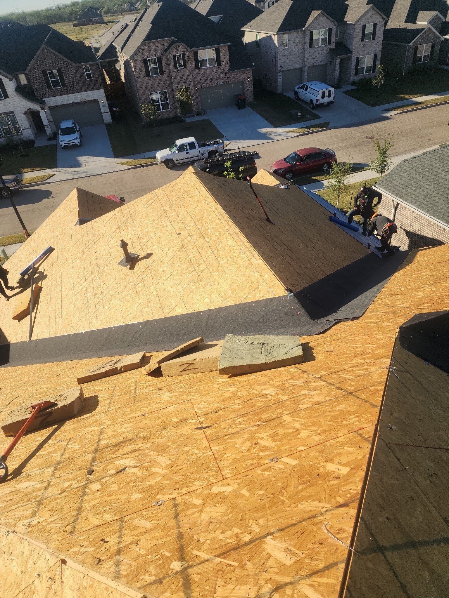 Exposed roof decking during tear-off phase of Anna roof replacement