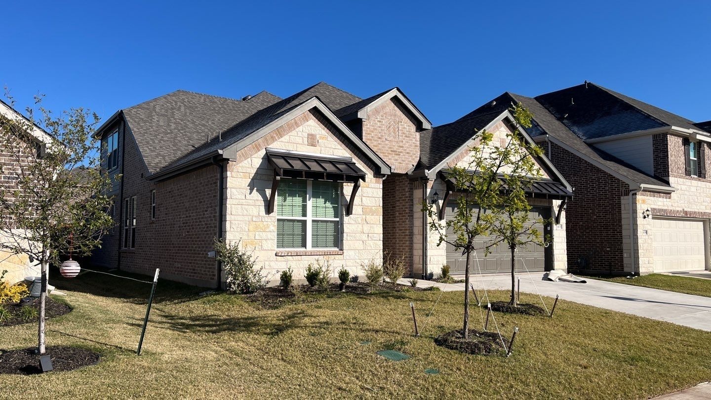 Finished roof replacement in Anna showing new Class 4 shingles after storm repair