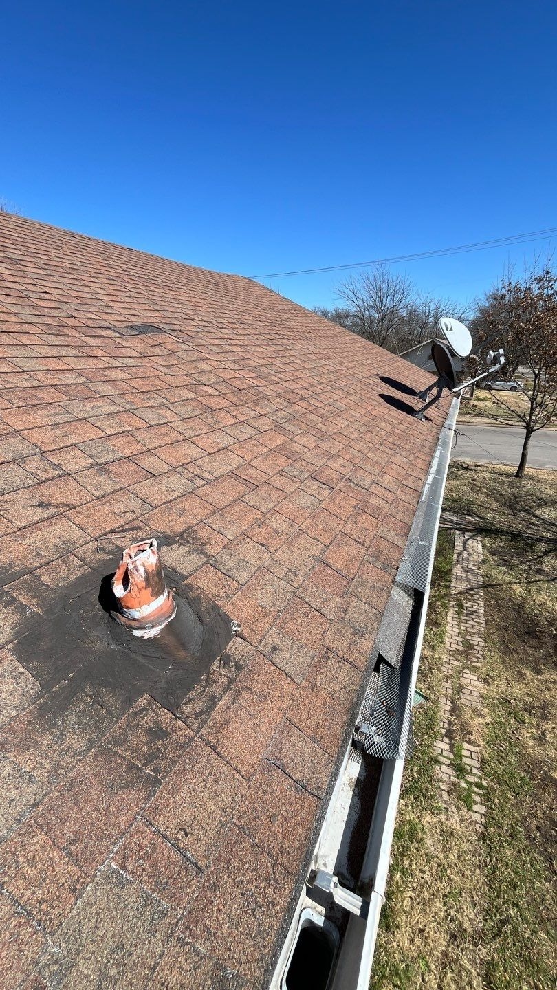 Bulging roof section where rafters bowed, seen before this Sherman, TX roof repair