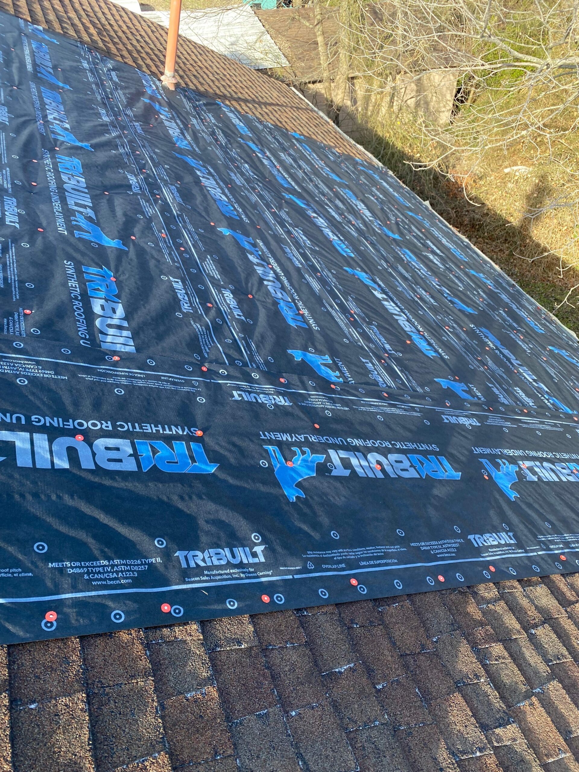 Second repaired section showing new underlayment after the roof repair in Sherman, TX