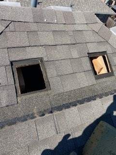 Crew removing torn roof vent during the roof repair in Melissa, TX