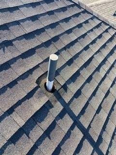 Technician installing new plumbing boot during the roof repair in Melissa, TX
