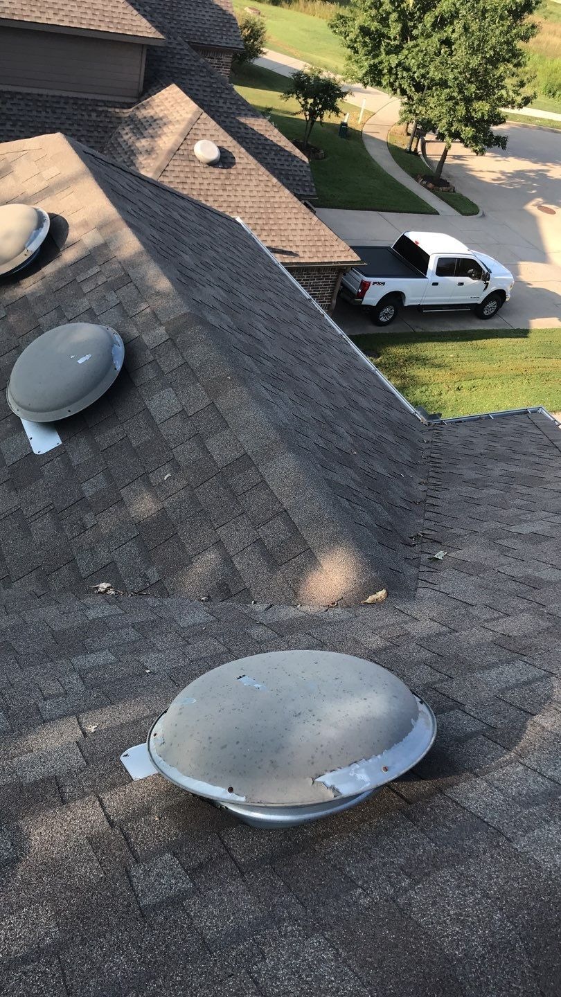 Wind-lifted shingle tabs documented before the roof replacement in Melissa, TX