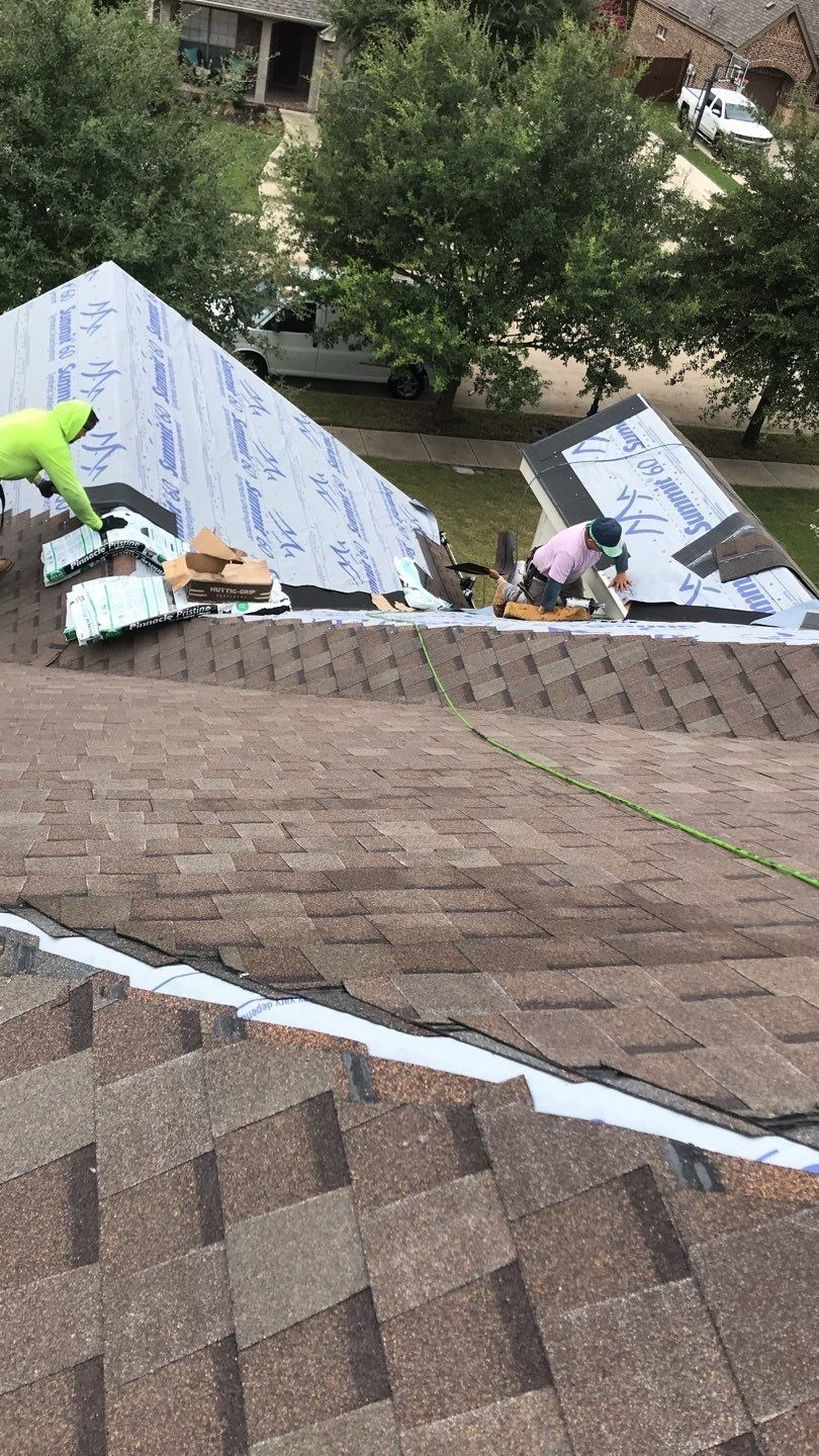 Flashing being installed around a roof penetration during the roof replacement in Melissa, TX