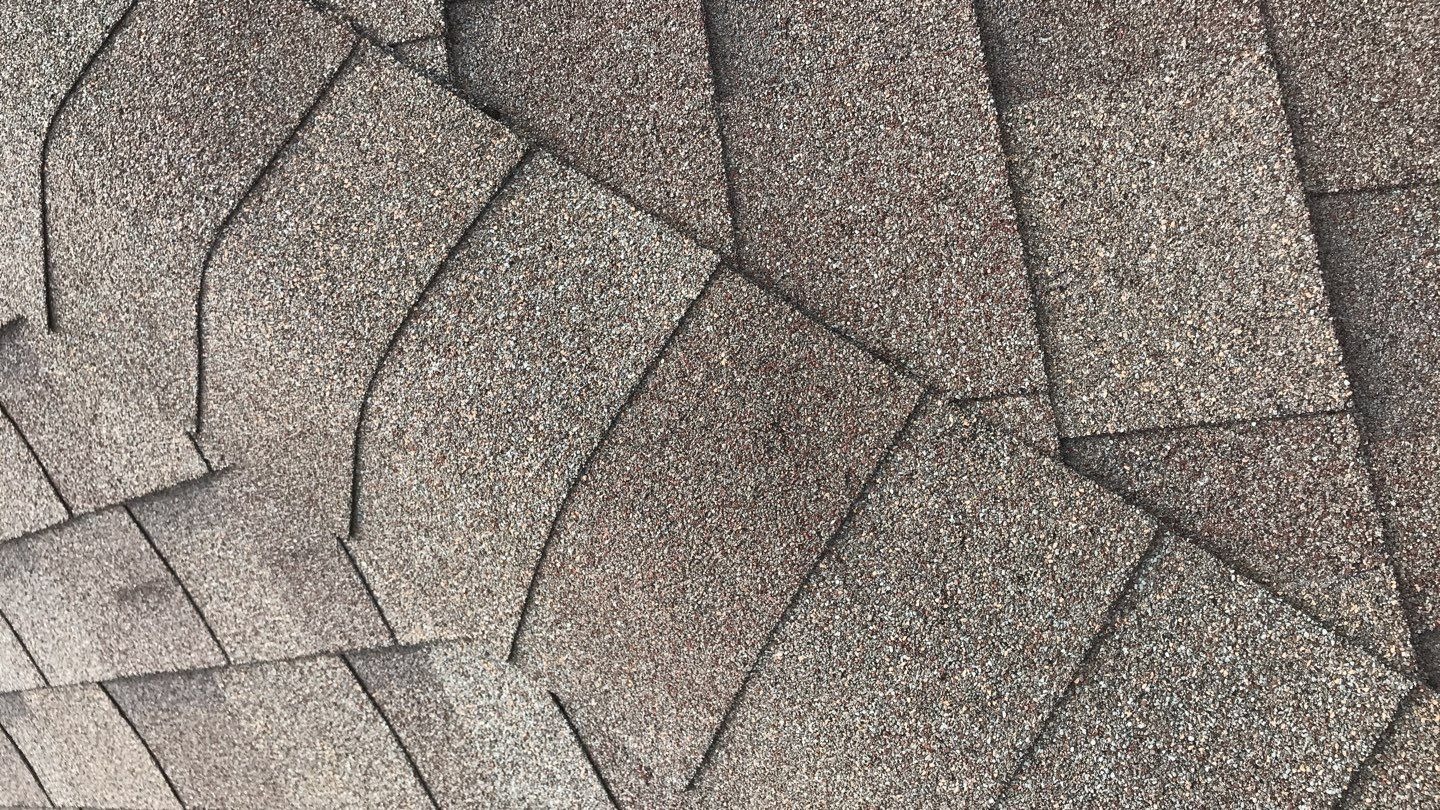 Storm-damaged flashing found near a roof penetration before the roof replacement in Melissa, TX