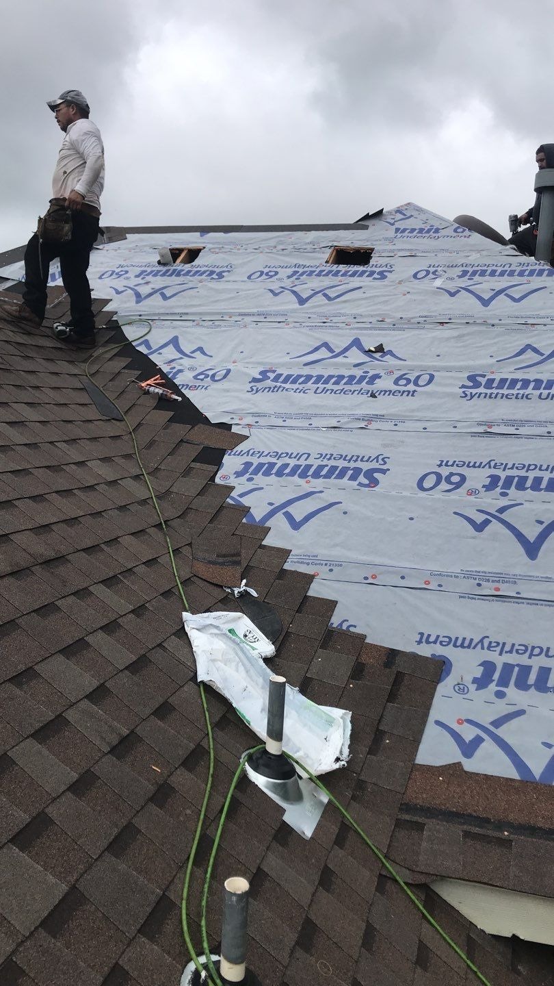 Synthetic underlayment rolled across the slope during the roof replacement in Melissa, TX