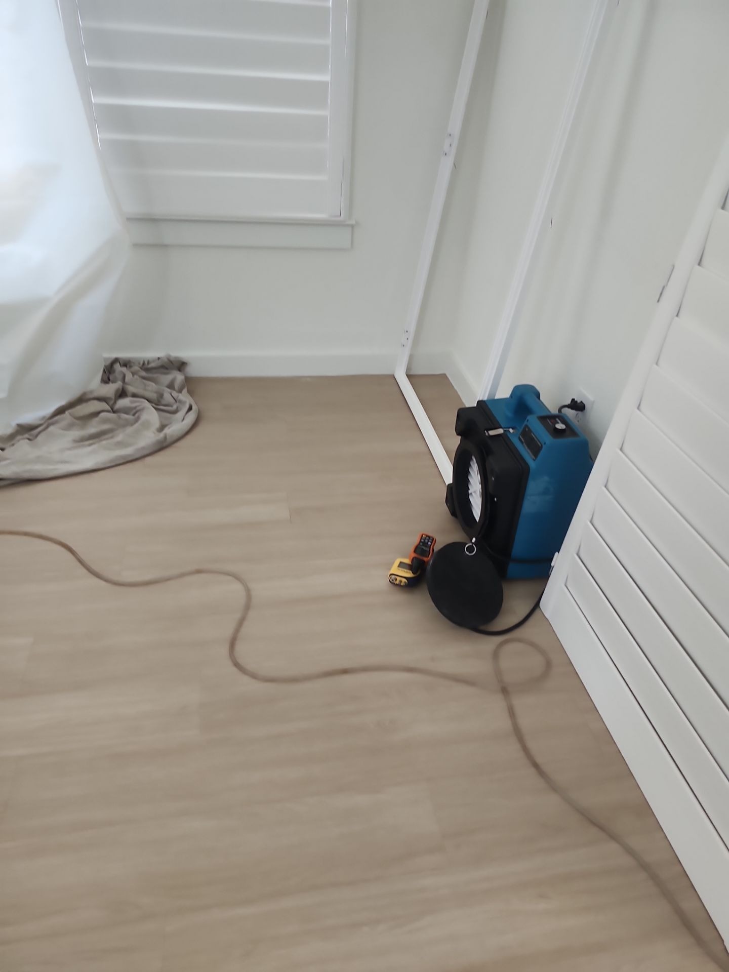 Exposed subfloor after flood cut during the Frisco water damage restoration project