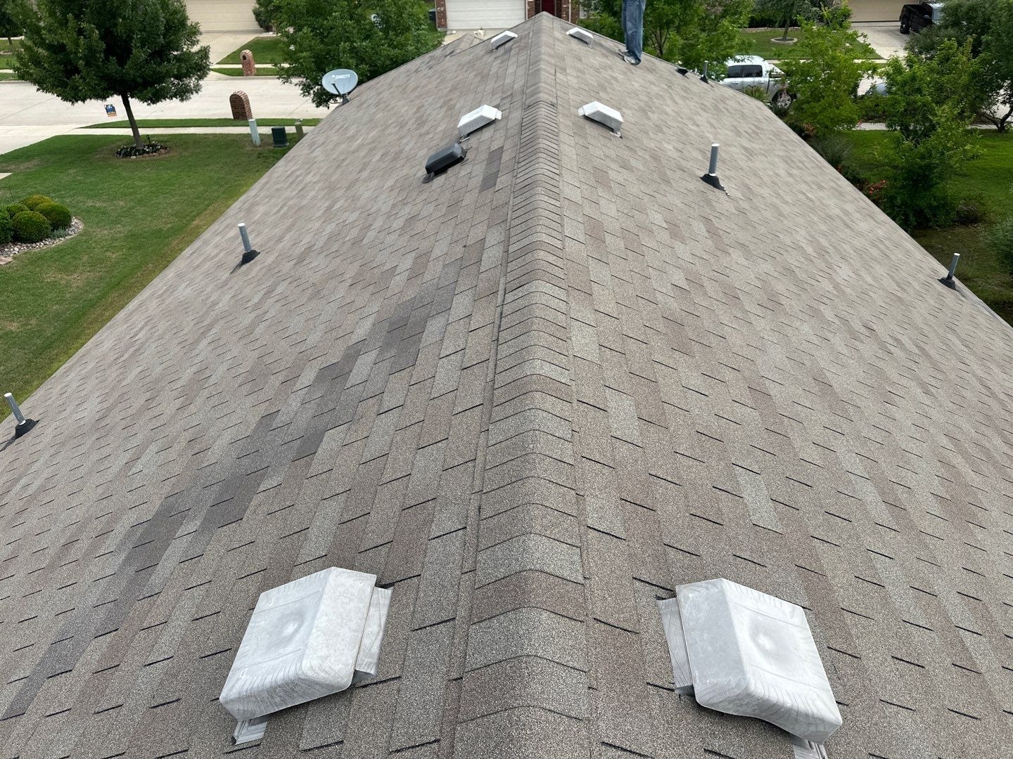 Original 3-tab roof and vents seen from the ridge during the storm damage inspection in Anna, TX