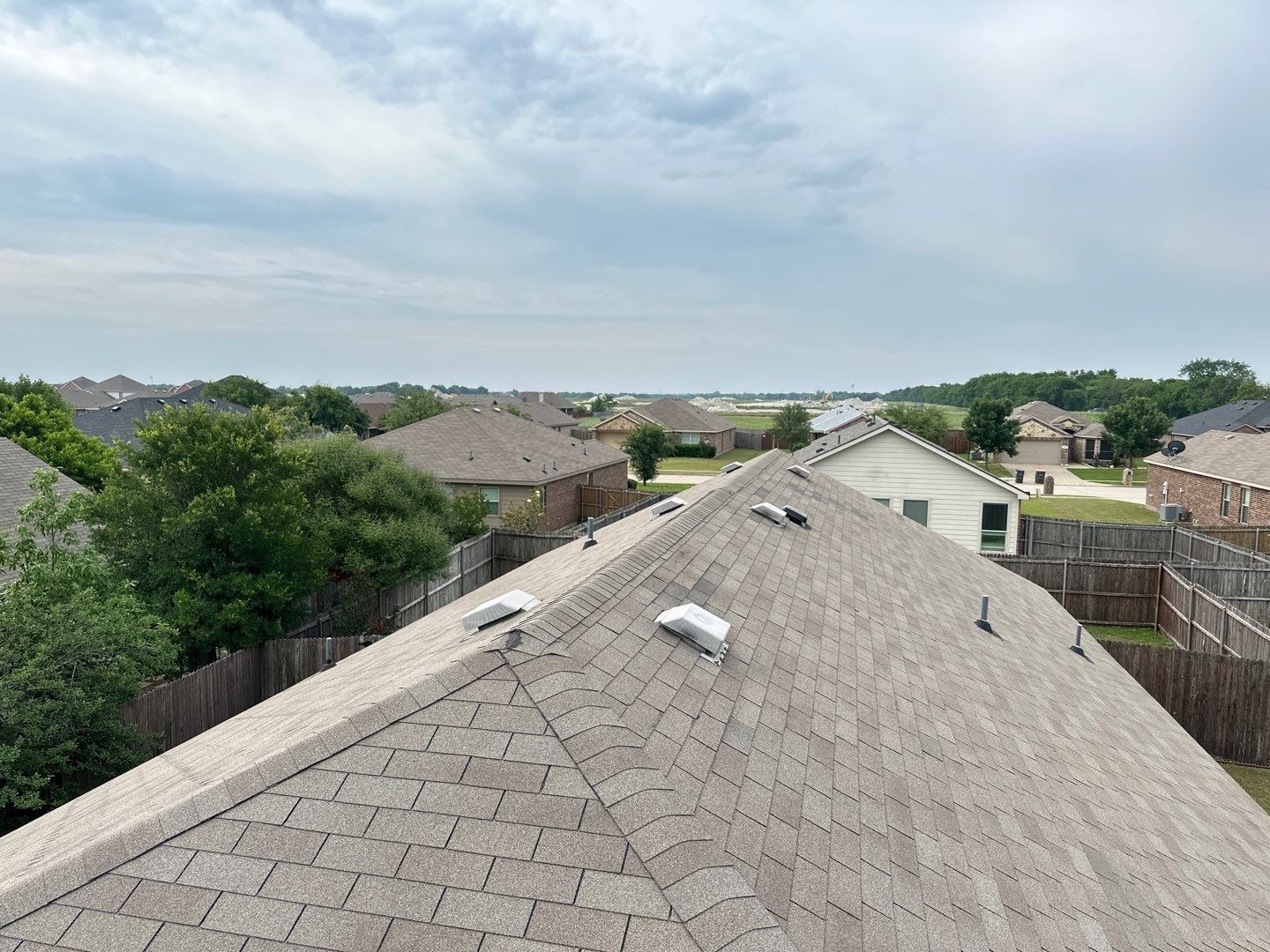 Wide view of the storm-damaged roof in Anna, TX before tear-off