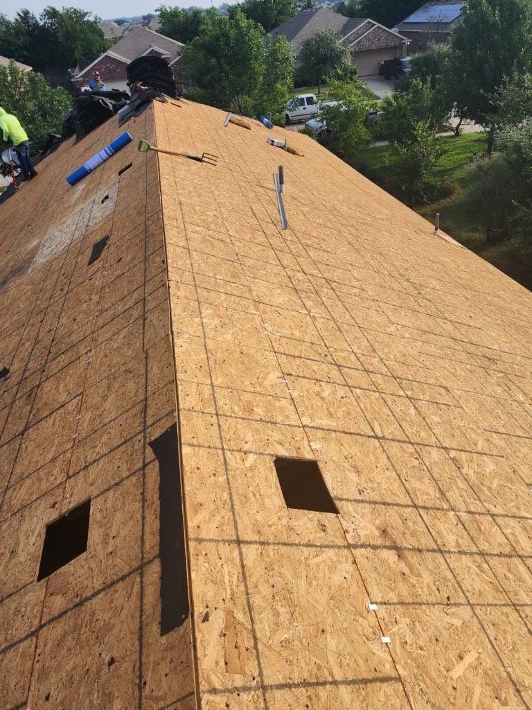 Roof deck exposed after the full tear-off during the roof replacement in Anna, TX