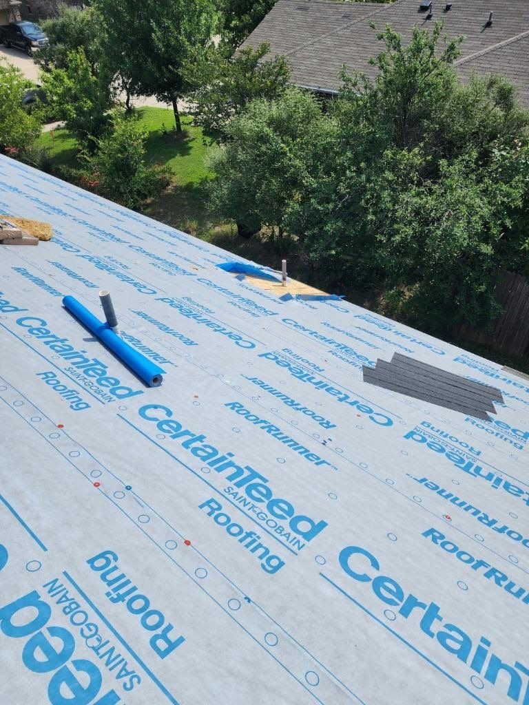 Synthetic underlayment installed on the roof deck before the new shingles, Anna, TX