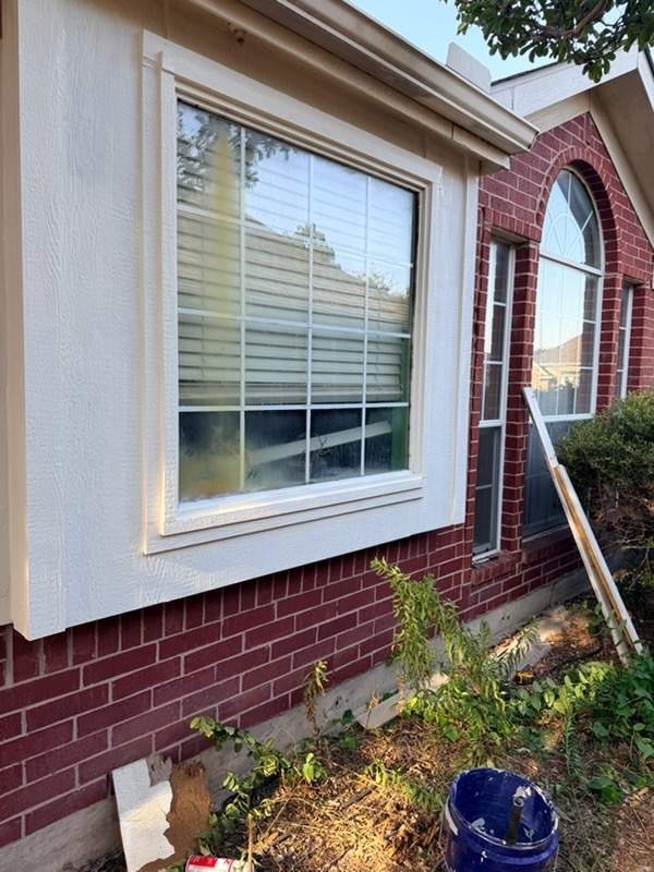 Finished painted siding and trim after reconstruction in Allen, TX