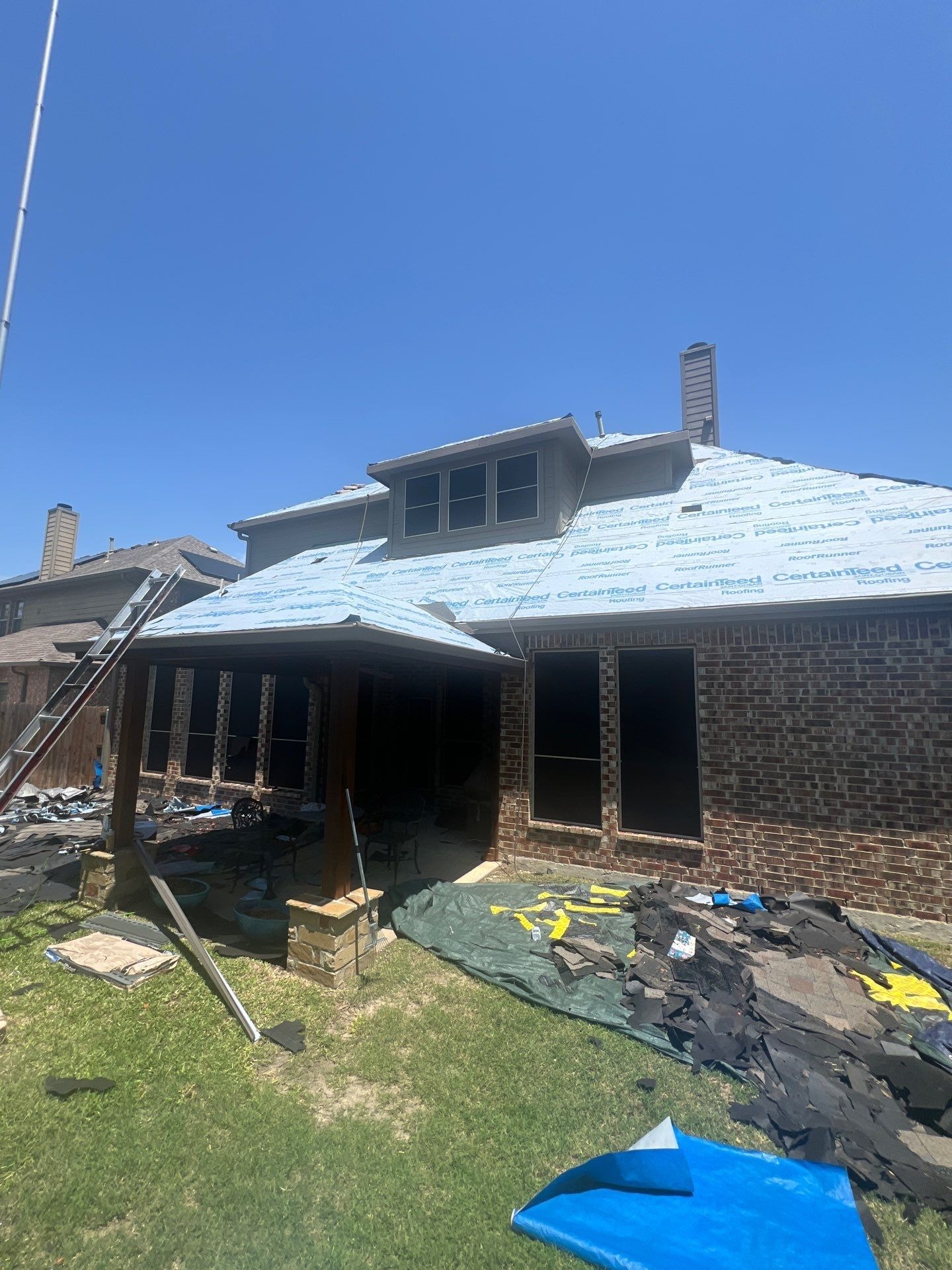 Crew installing new solar power vents during the roof replacement in Allen
