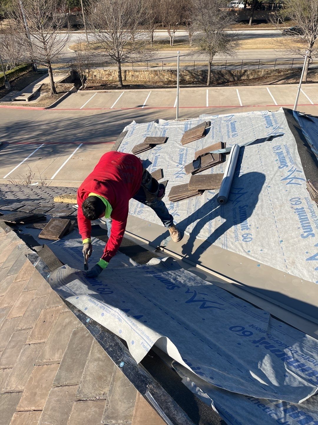 Completed concrete tile roof section after the roof replacement in McKinney, TX
