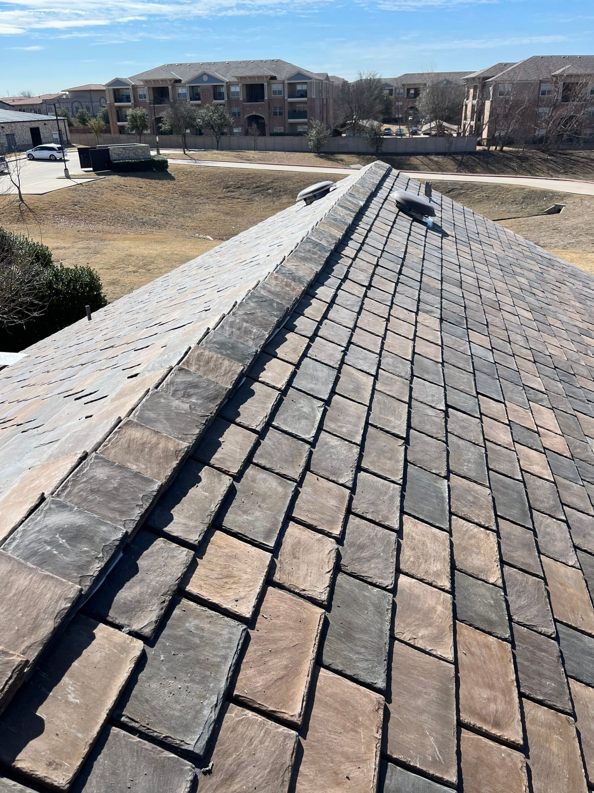 Full roof view of the commercial building after the roof replacement in McKinney, TX