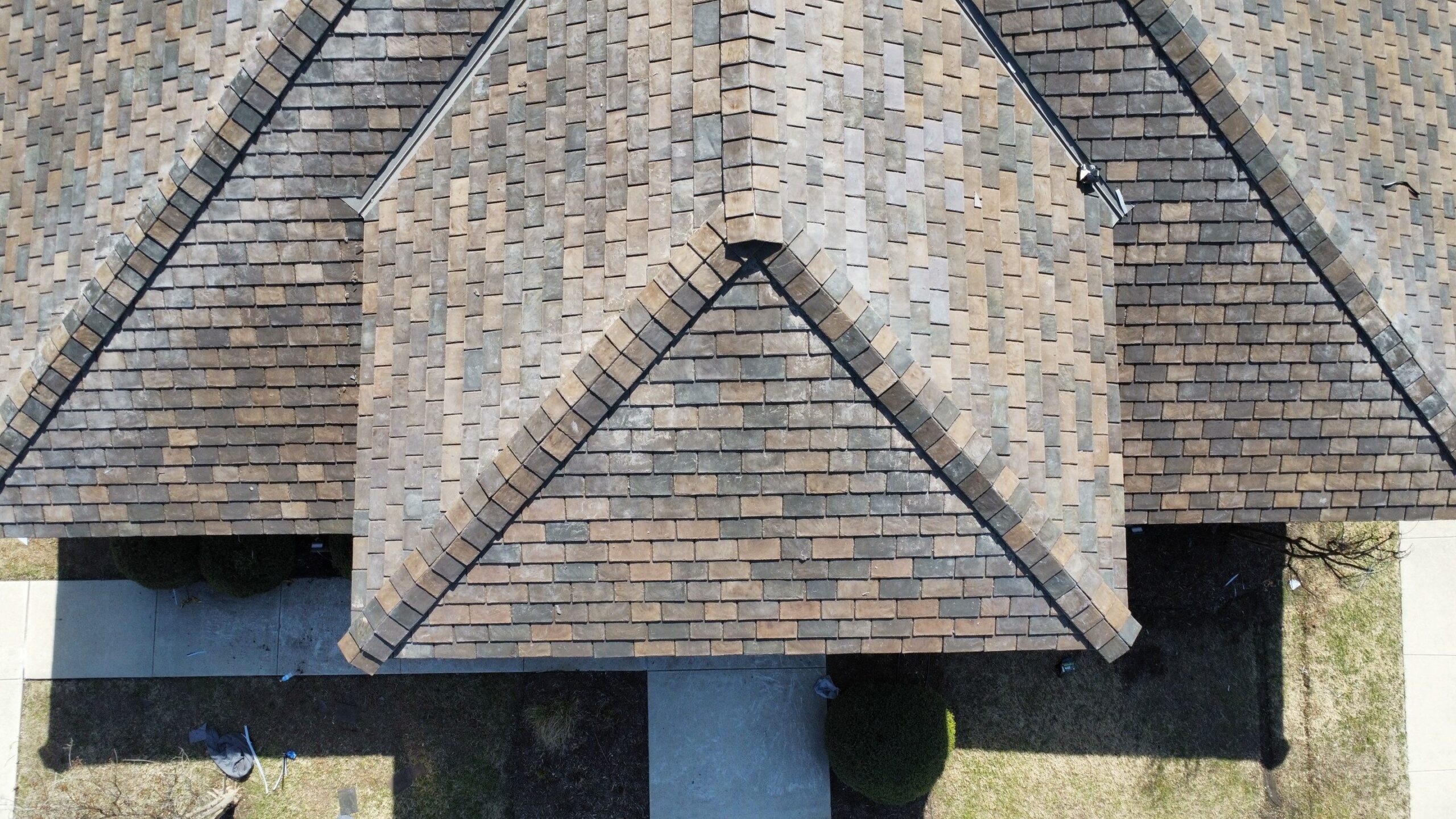 Close-up of new concrete tile installation after the roof replacement in McKinney, TX