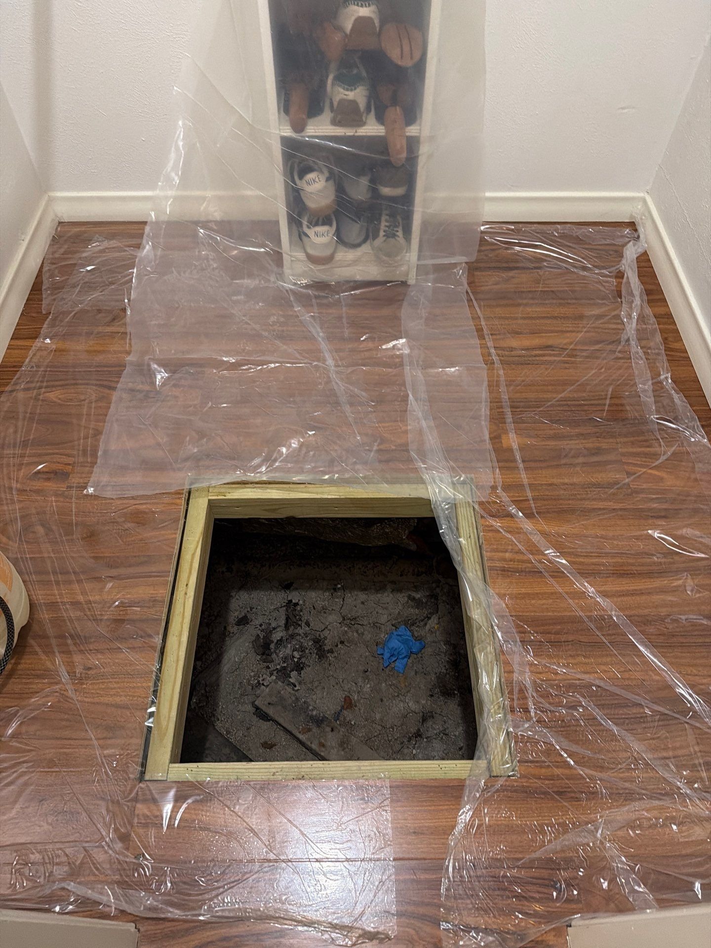 Technician applying antimicrobial treatment during crawl space moisture control in Dallas, TX