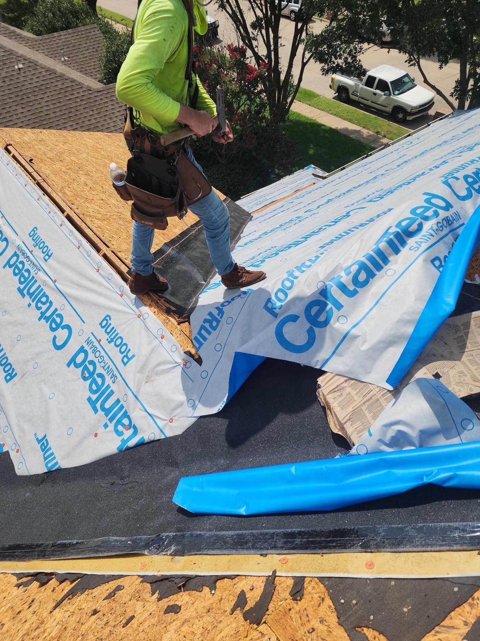 Fresh shingle courses going down during the roof replacement in Allen, TX