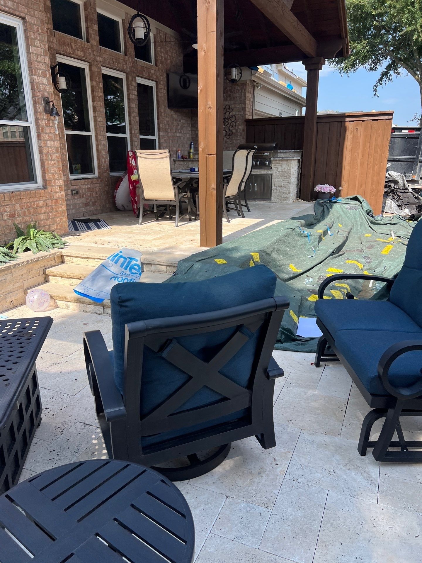 Crew tearing off old shingles during the roof replacement in Allen, TX