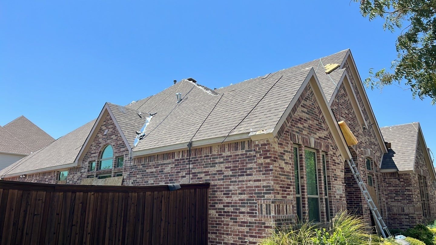 Completed roof with new shingles after the roof replacement in Allen, TX