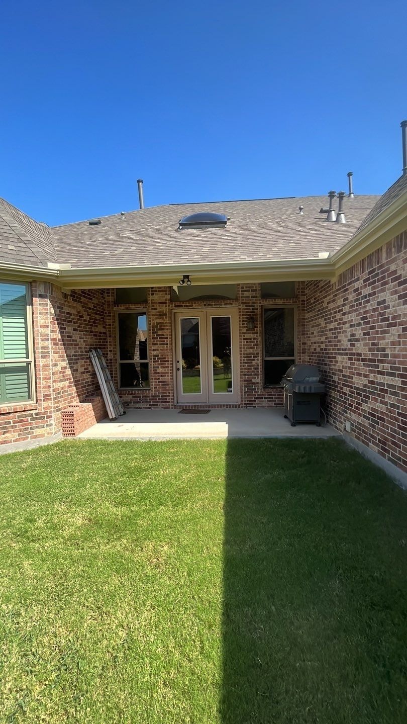 Finished exterior with new gutters after the roof replacement in Allen, TX