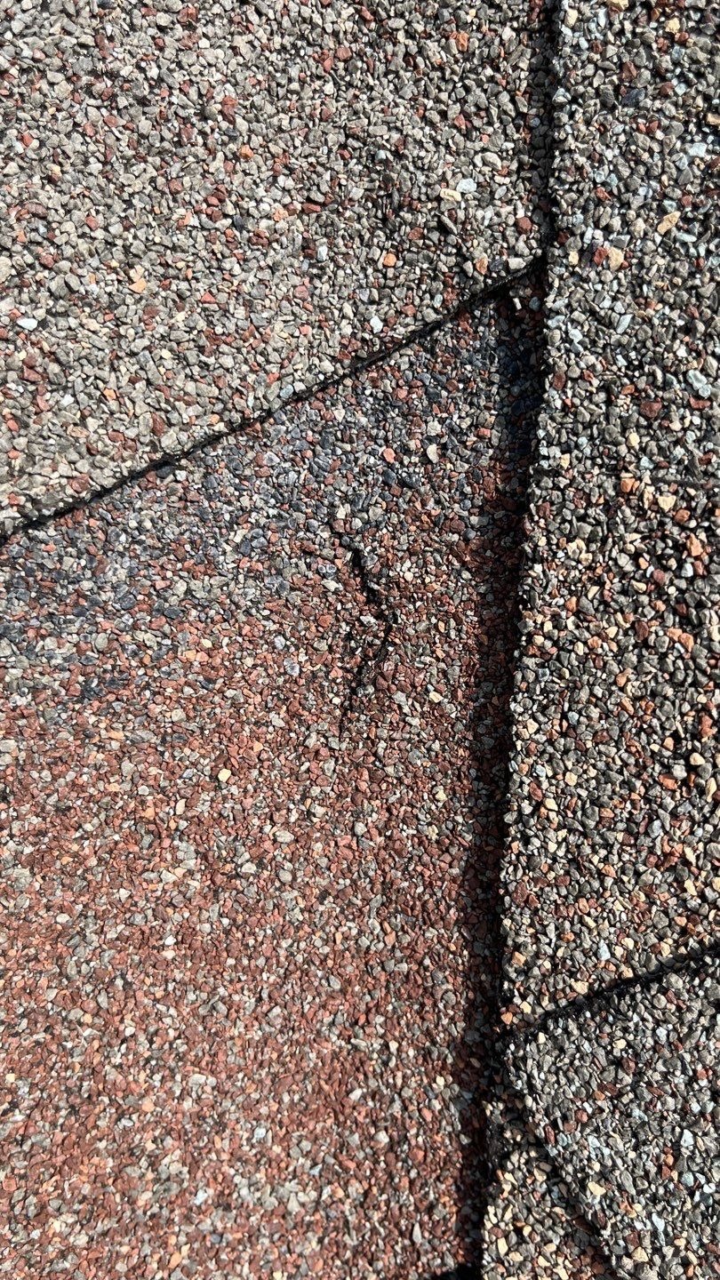 Aging passive vents on the roofline before the roof replacement in Allen, TX