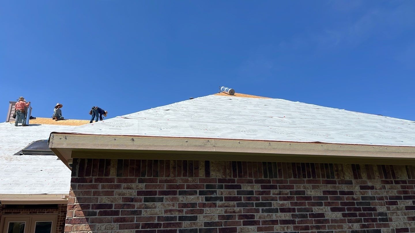 Fresh shingles going down over new underlayment during the roof replacement in Allen, TX
