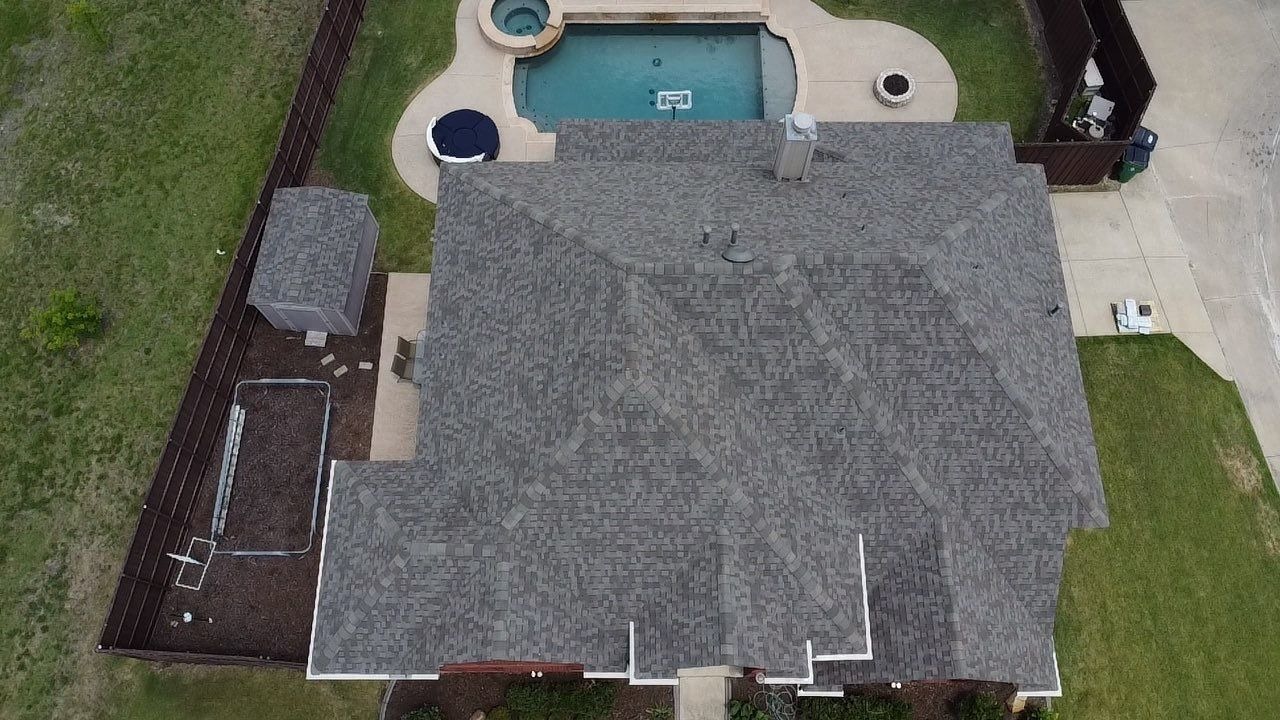 Completed architectural shingle roof after roof replacement in McKinney, TX