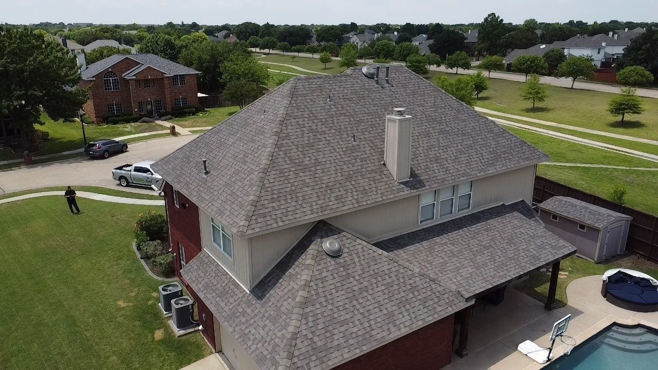 Finished roofline showing new vents and flashing after roof replacement in McKinney, TX