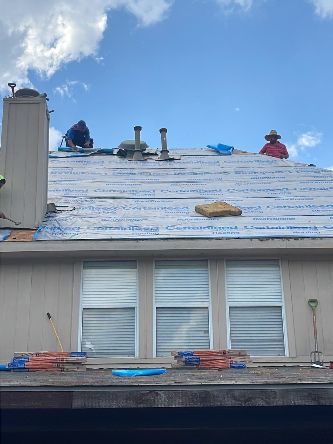 New architectural shingles going down mid-installation during roof replacement in McKinney, TX