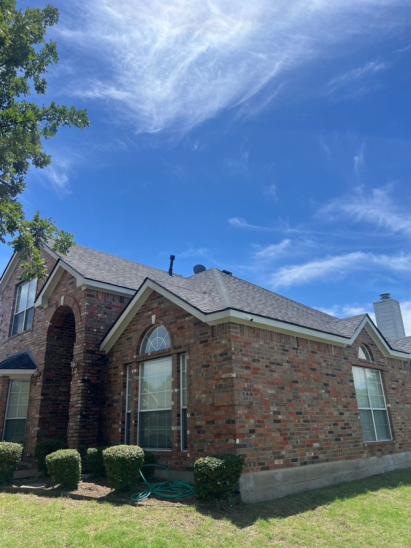 Bare roof deck exposed after full tear-off during the Allen, TX roof replacement