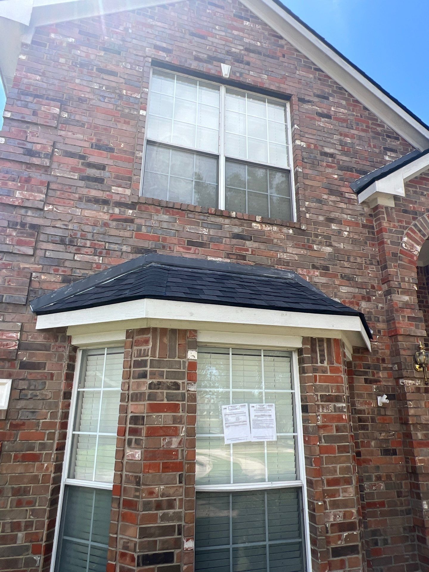 Finished black architectural shingle roof after the completed roof replacement in Allen, TX