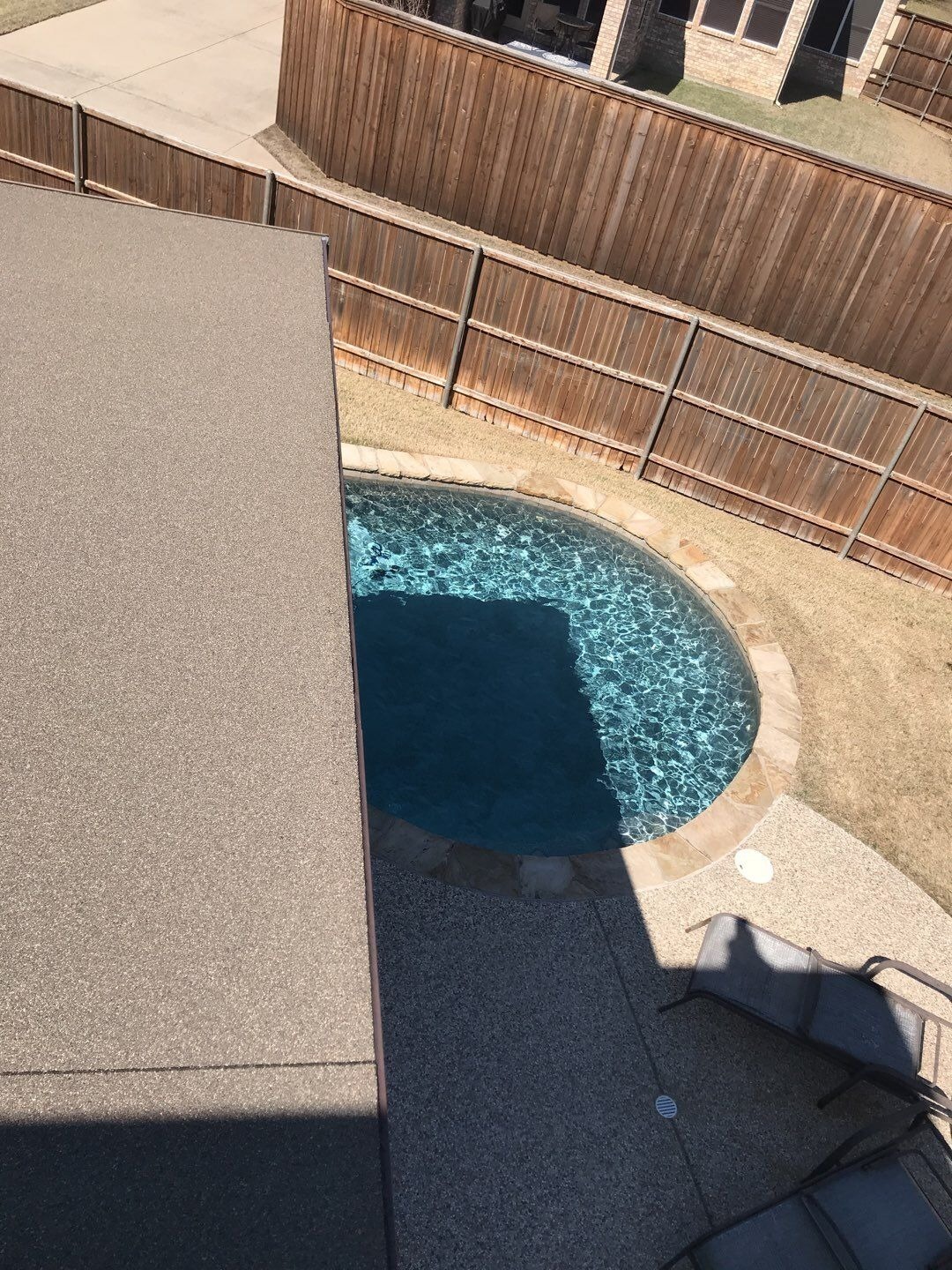 Wide view of hail-damaged roof slope before the roof replacement in Allen, TX