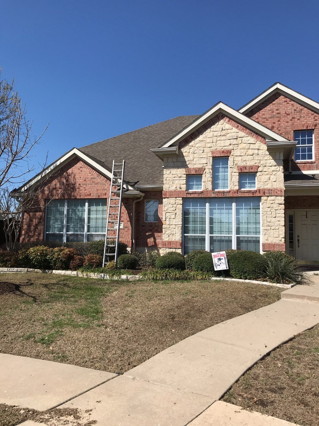 Hail bruising and granule loss visible on shingles before the roof replacement in Allen, TX