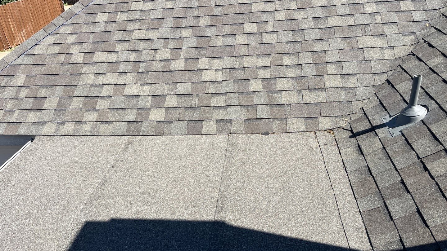New shingles and ridge line after the finished roof replacement in Allen, TX