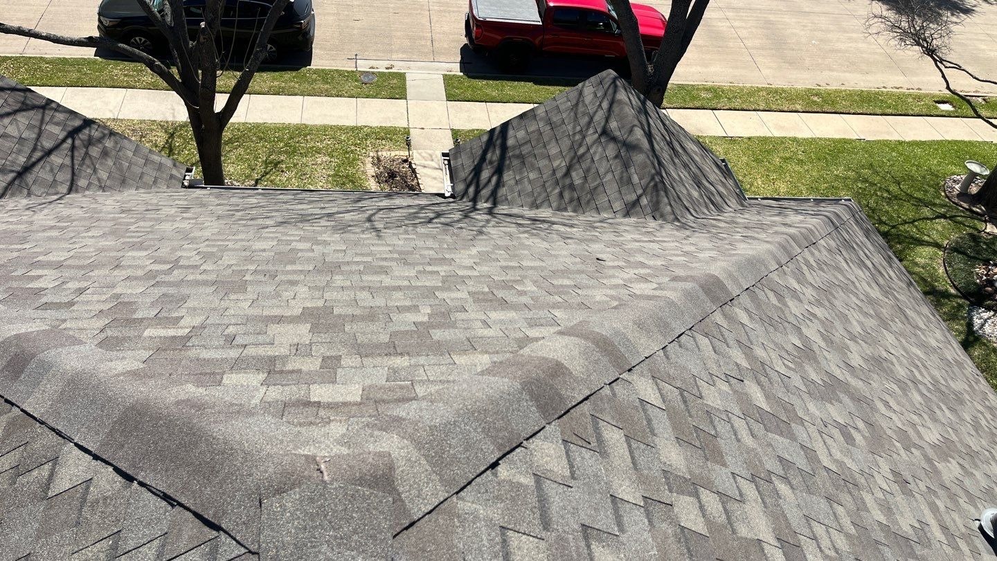 Final wide shot of the completed roof replacement in Allen, TX