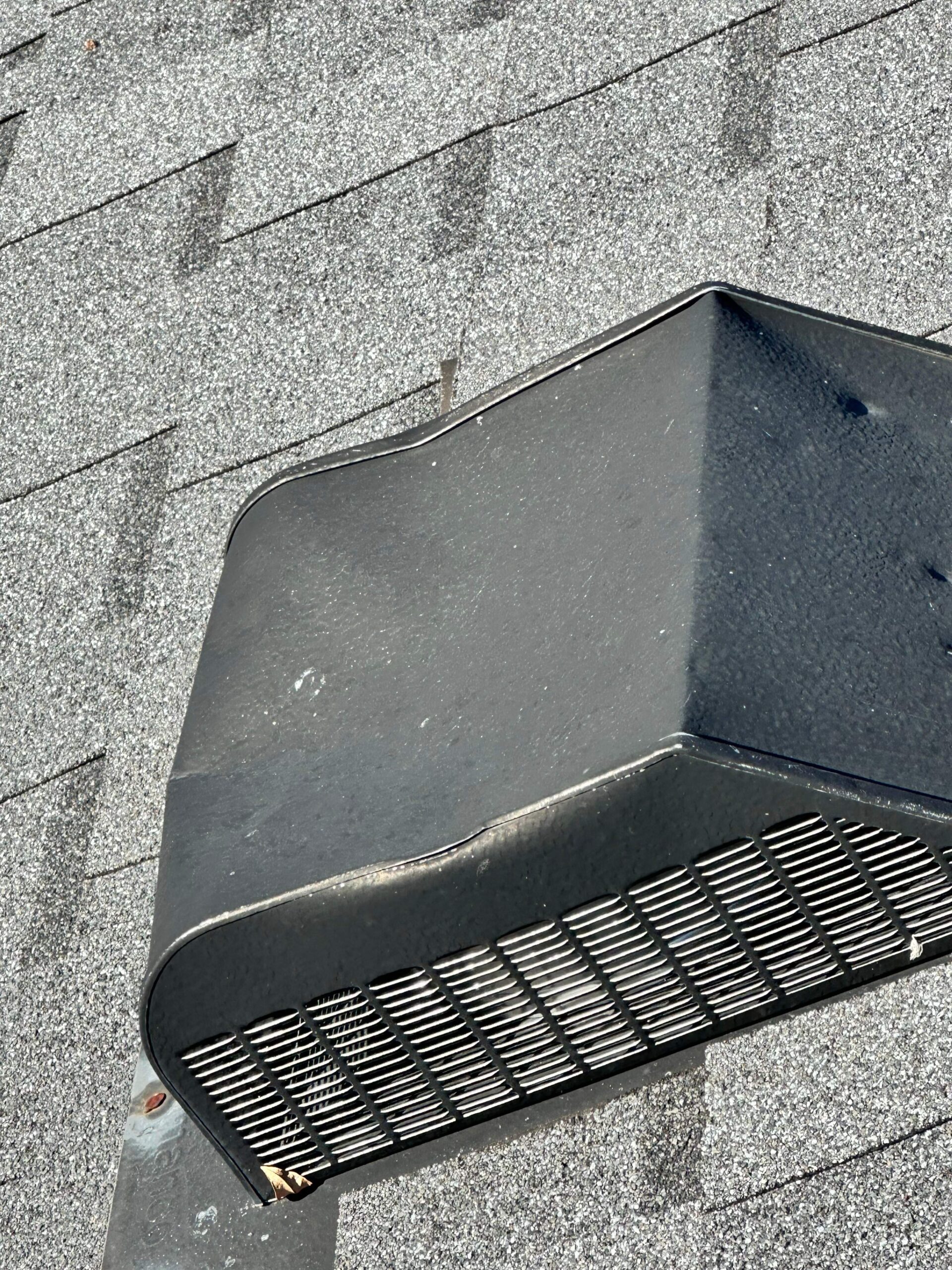 Close-up of hail bruising on shingles before the roof replacement in Allen, TX