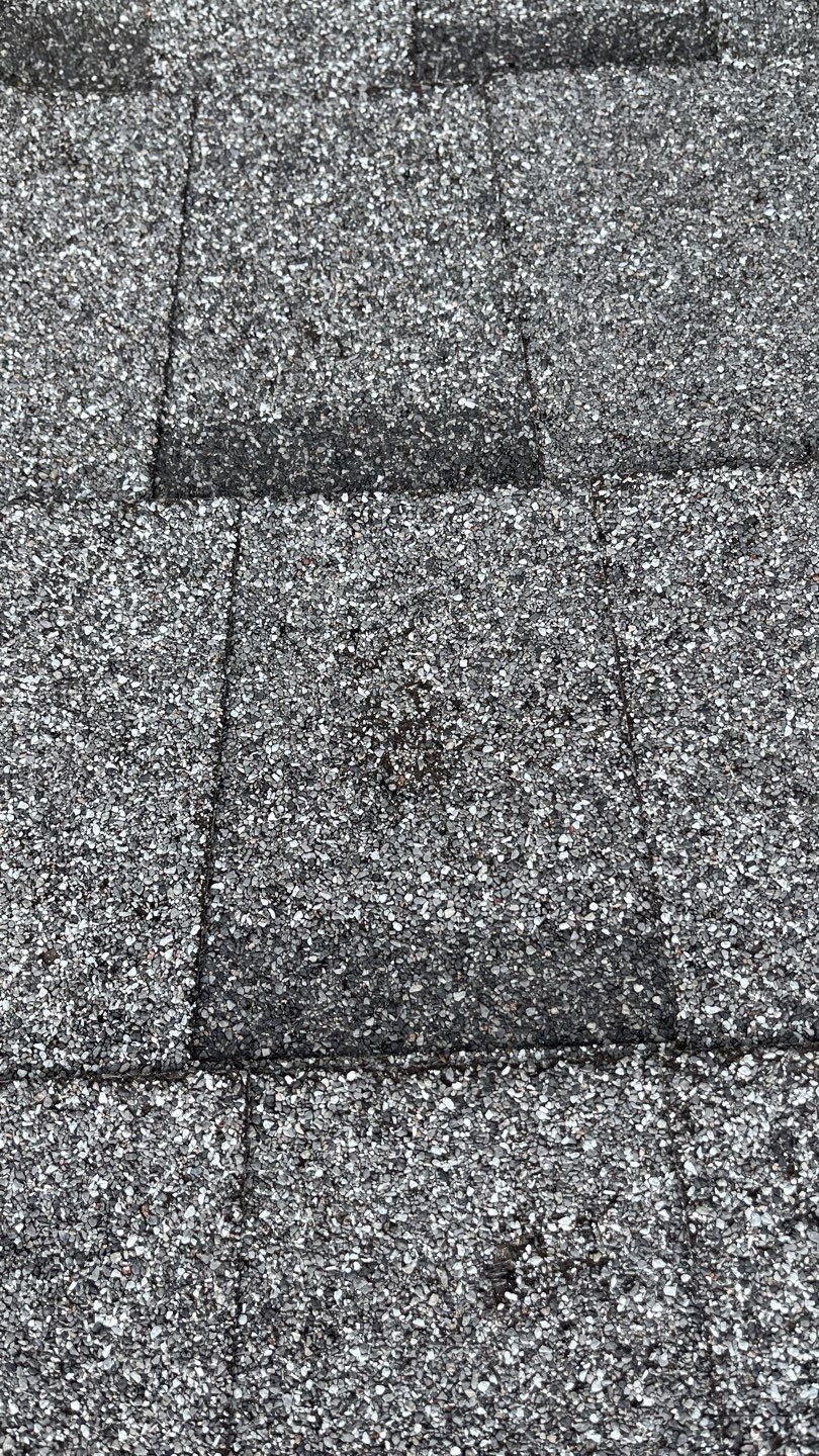 Roof valley showing hail impact before the roof replacement in Allen, TX
