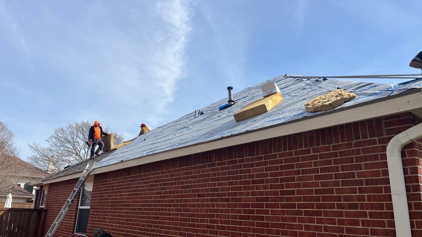 Multiple underlayment layers exposed during the roof replacement in Allen, TX