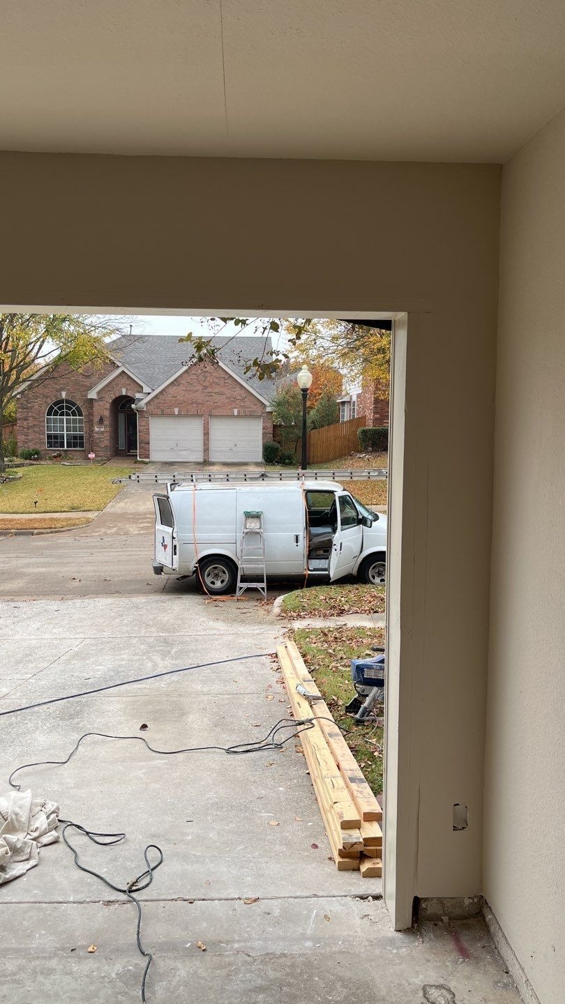 Double garage door frame set in place during the McKinney, TX reconstruction