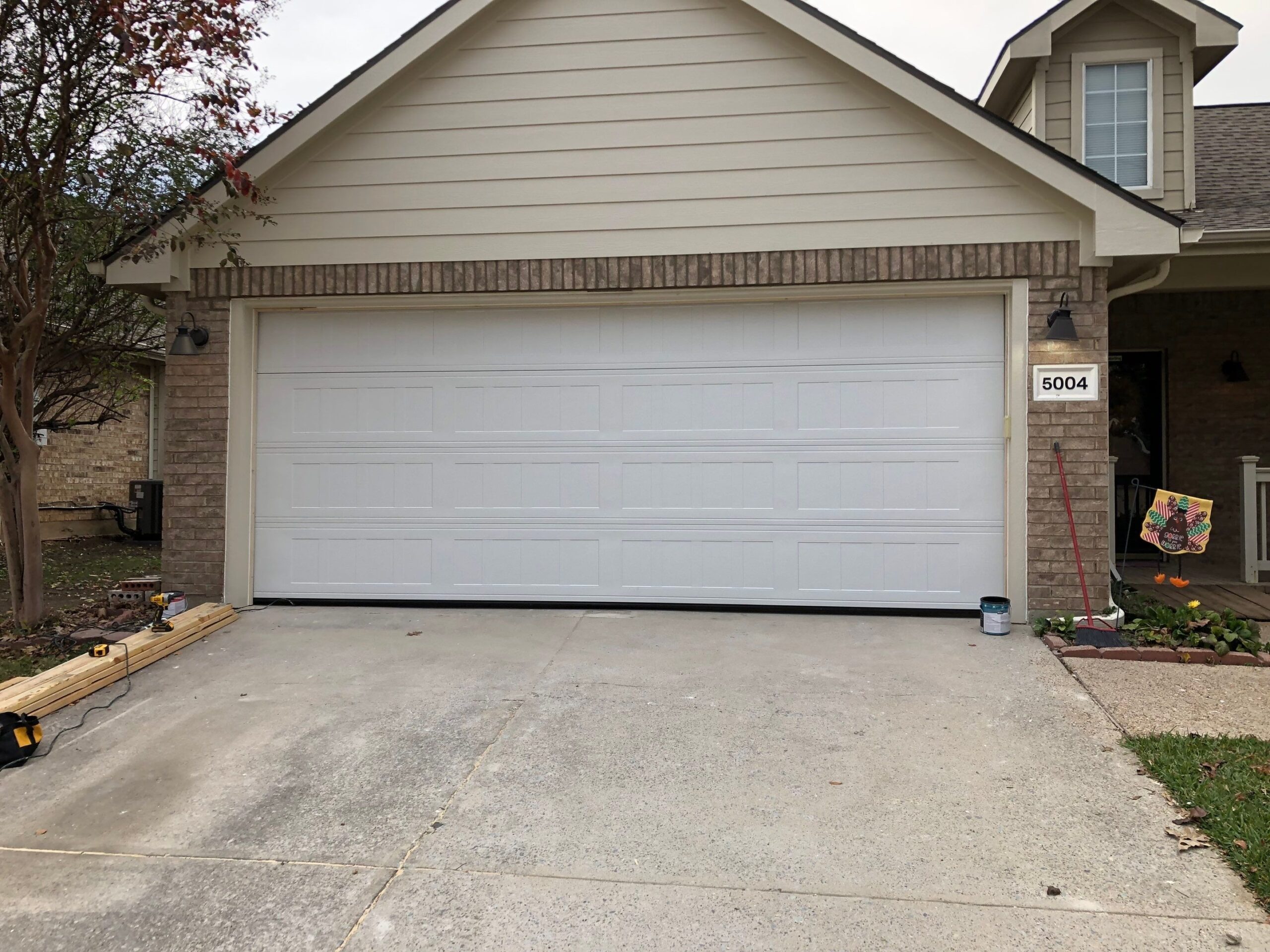 Completed double garage door after the reconstruction in McKinney, TX