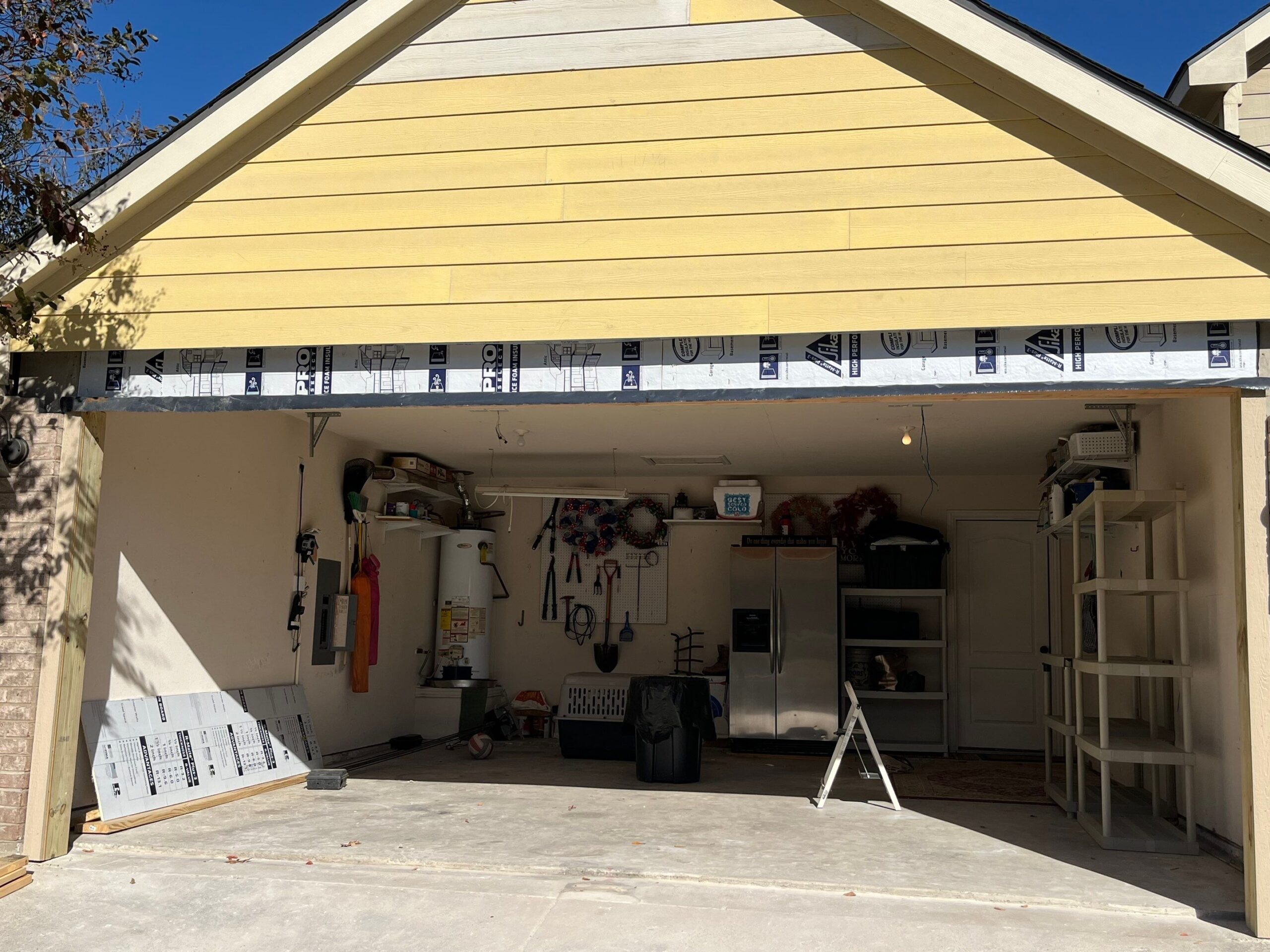 Interior drywall removed inside the garage during the McKinney, TX reconstruction