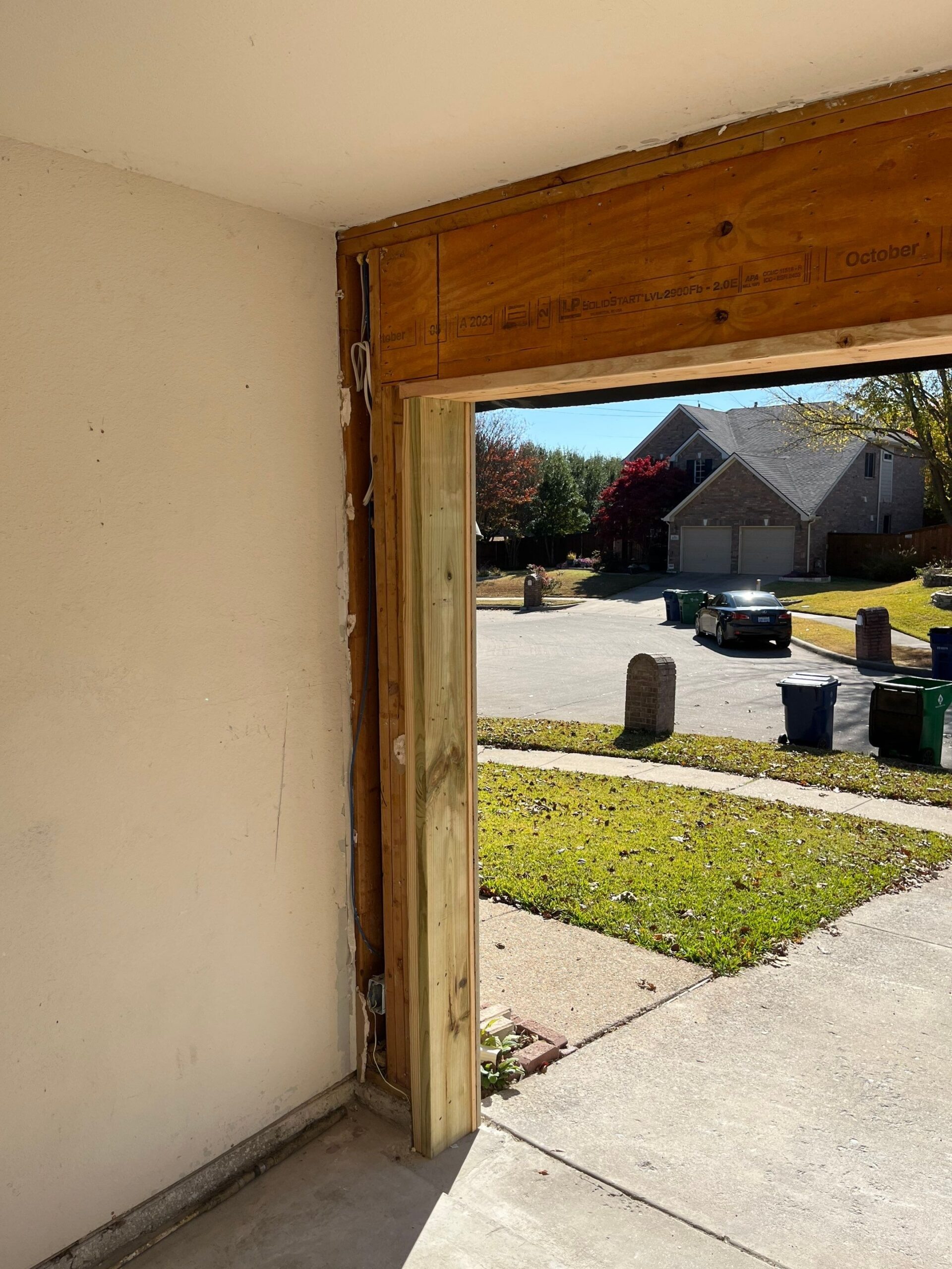 Framing exposed inside the garage during the reconstruction in McKinney, TX