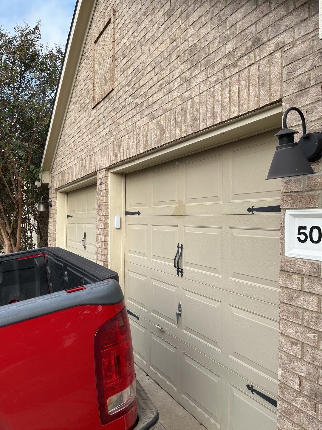 Two single garage doors before the reconstruction in McKinney, TX begins